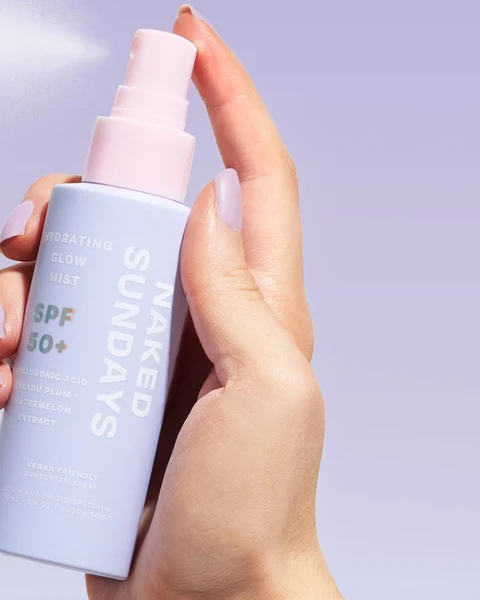 Naked Sundays SPF 50+ mist in hand