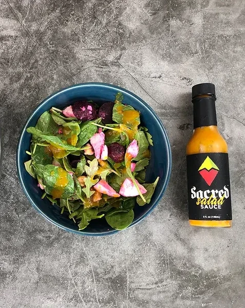Sacred Salad Sauce with a fresh salad