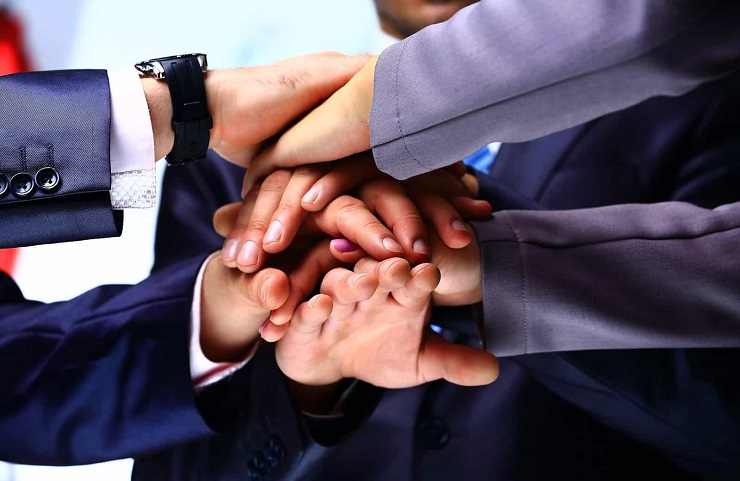 Employee Engagement- Hands of a group of businessmen