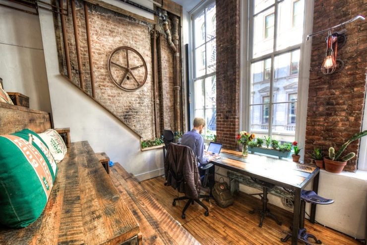 Man with his laptop in a coworking space