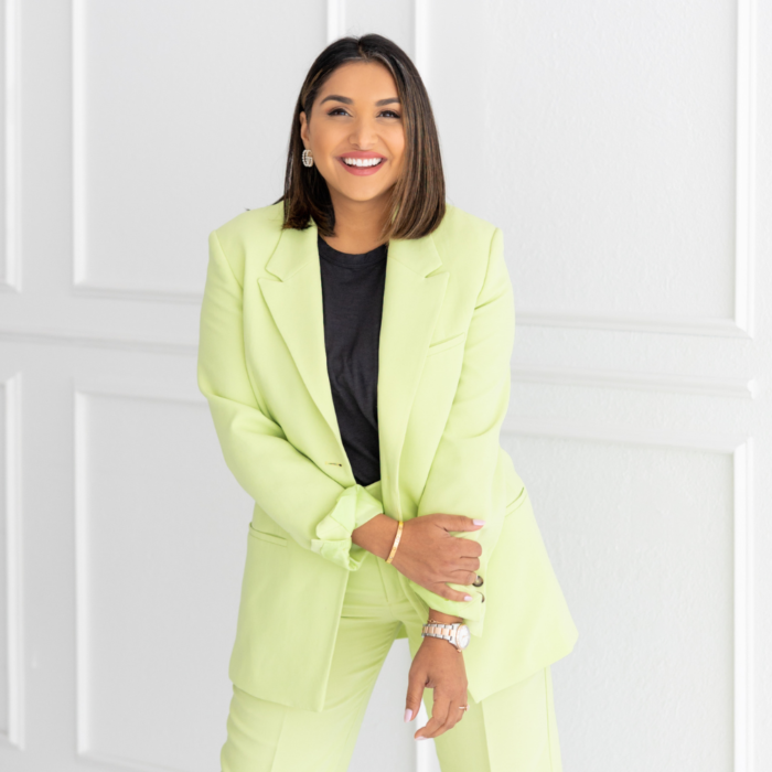Suneera madhani standing green suit