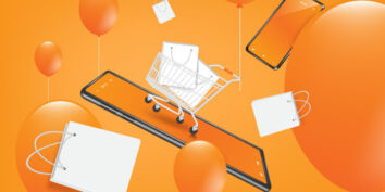 Phone with shopping cart and orange balloons.