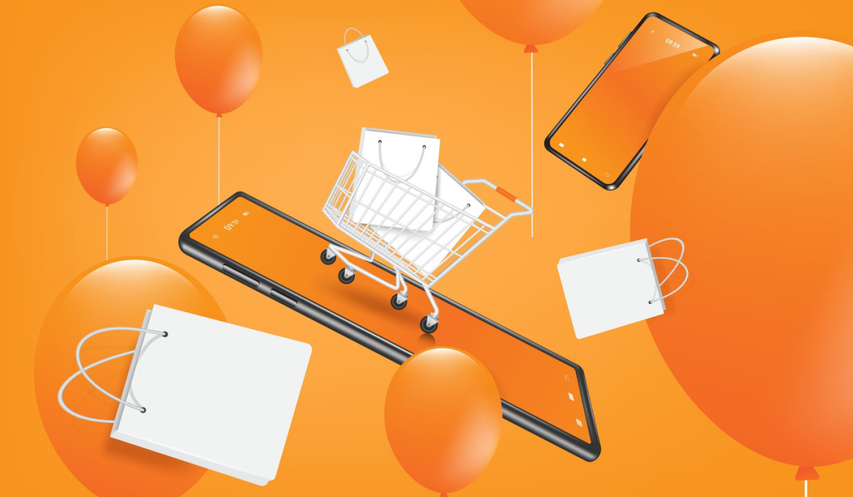 Phone with shopping cart and orange balloons.