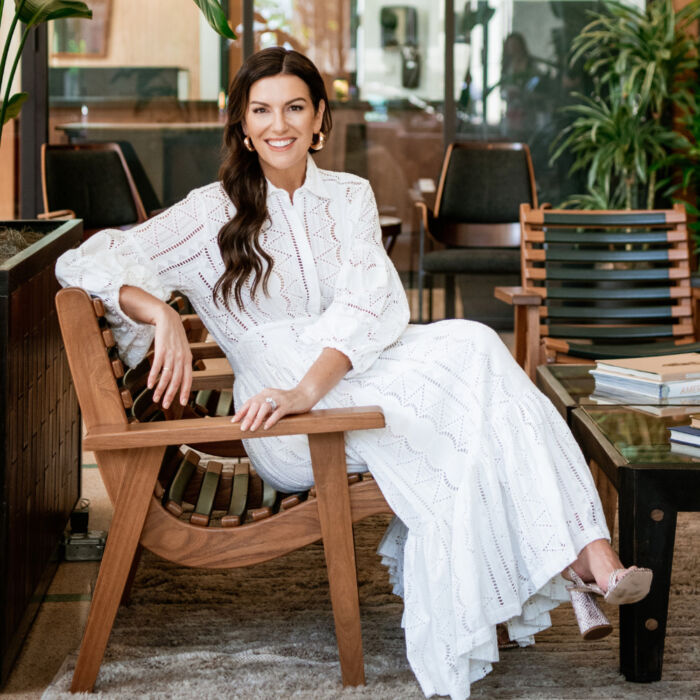Amy porterfield sitting in chair